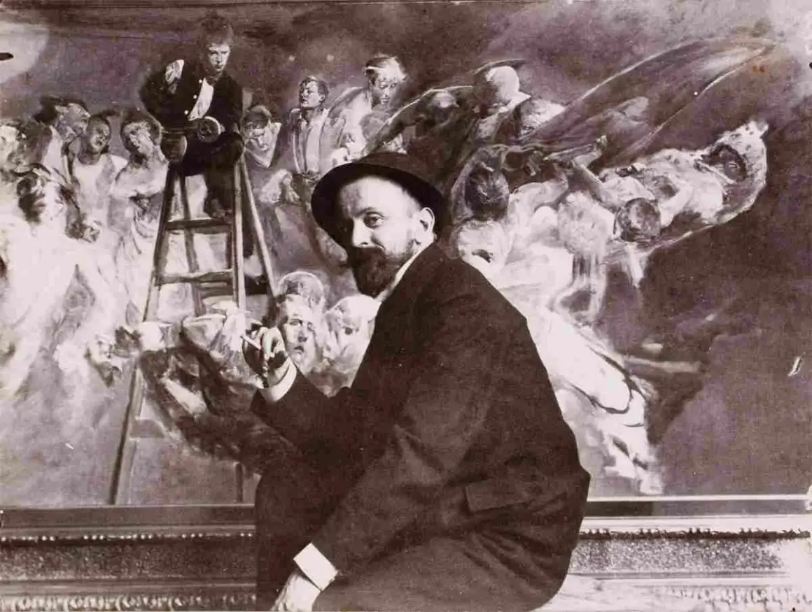 Malczewski obrazy: artysta w kapeluszu przed malowidłem z drabiną i postaciami.